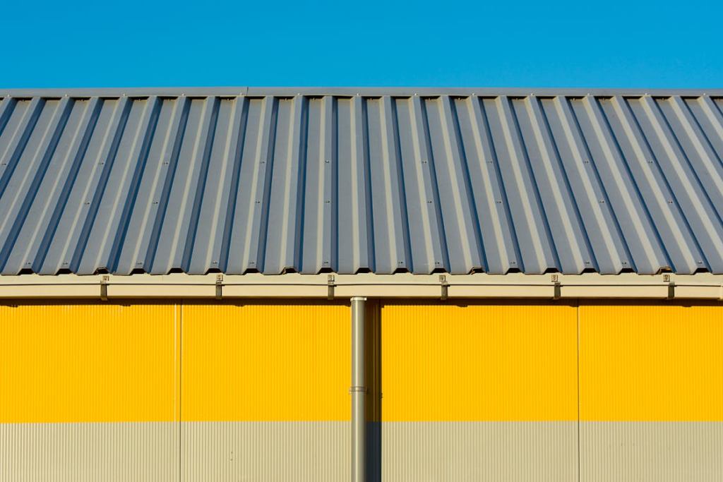 Close-up of industrial metal roof panels reflecting sunlight for energy efficiency in Florida heat