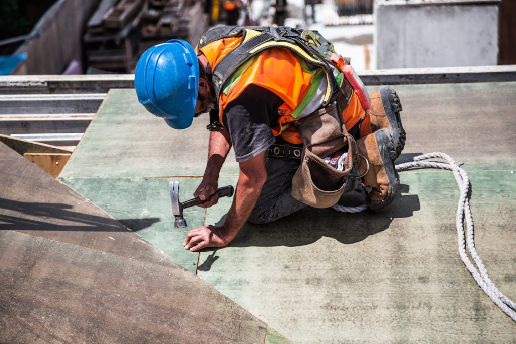 An image of a roofer working on a roof