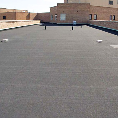 Completed flat commercial roofing system installed by commercial roofing contractors in Tampa, showcasing a smooth membrane surface