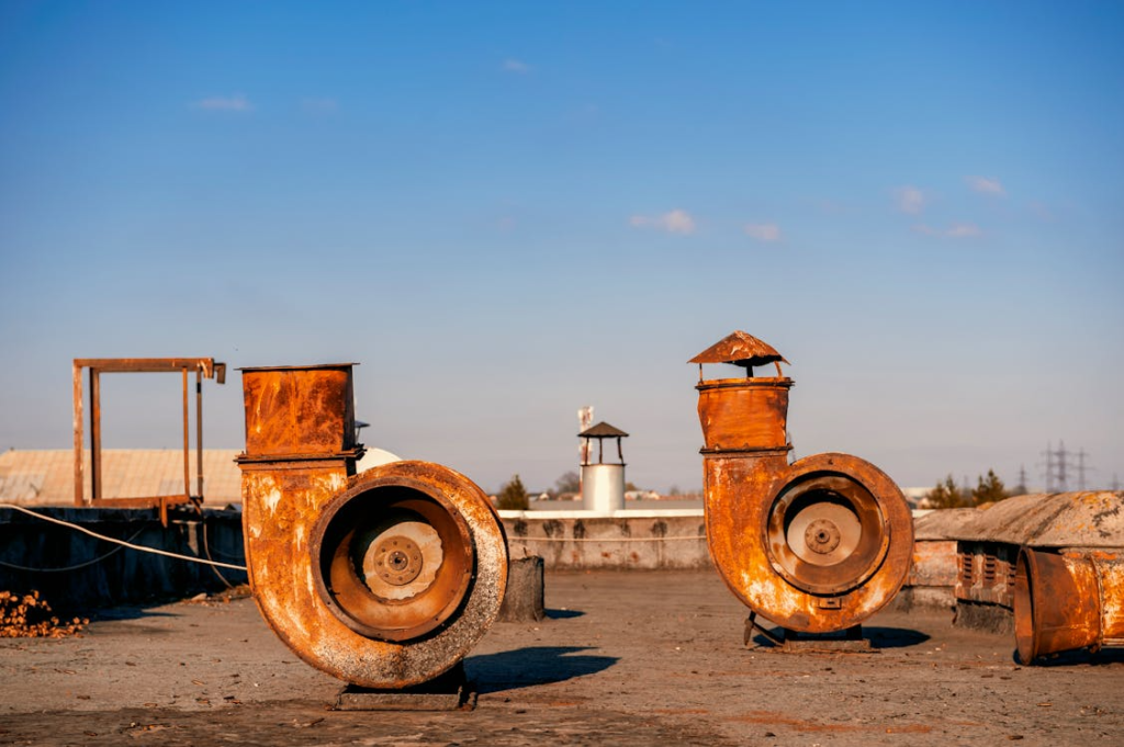 industrial vent pipes on a commercial rooftop
