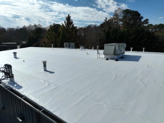 An image of a roofer working on a roof