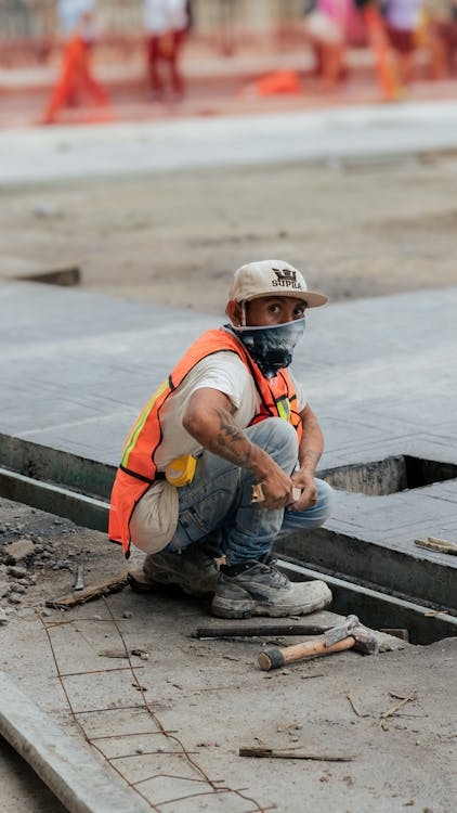 An image of a roofer working on a roof