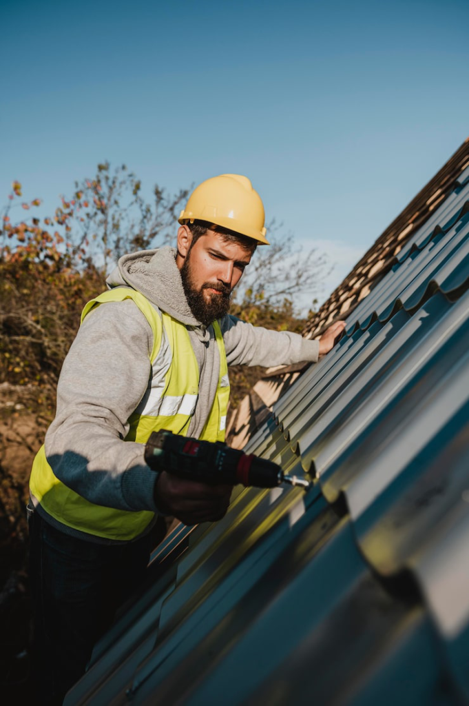 A commercial roofing contractor repair replacing a roof