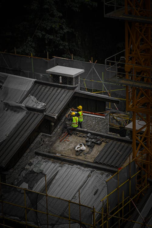 two people working on the rooftop