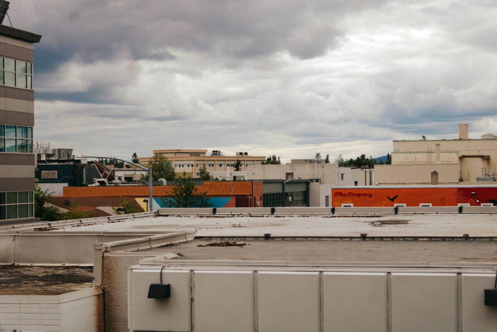 clouds over a building with a flat roof