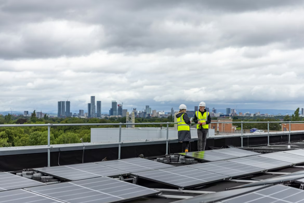 people standing on the top of the roof