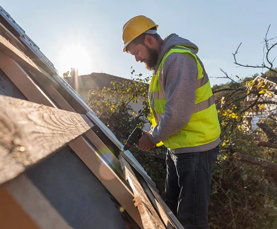 A commercial roofing contractor replacing a roof