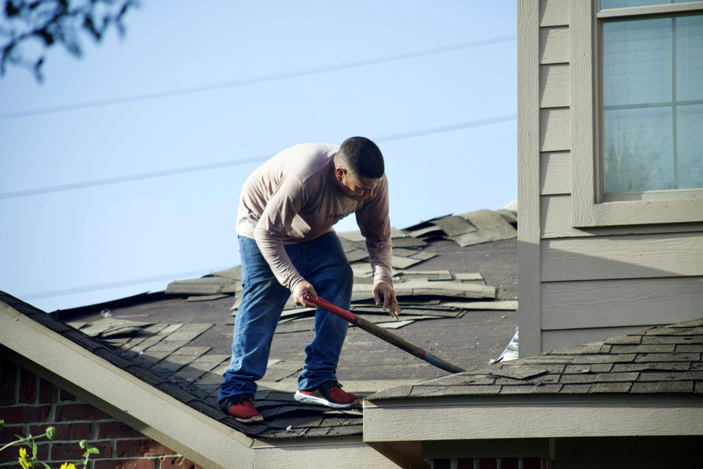 A roofer working on a roof