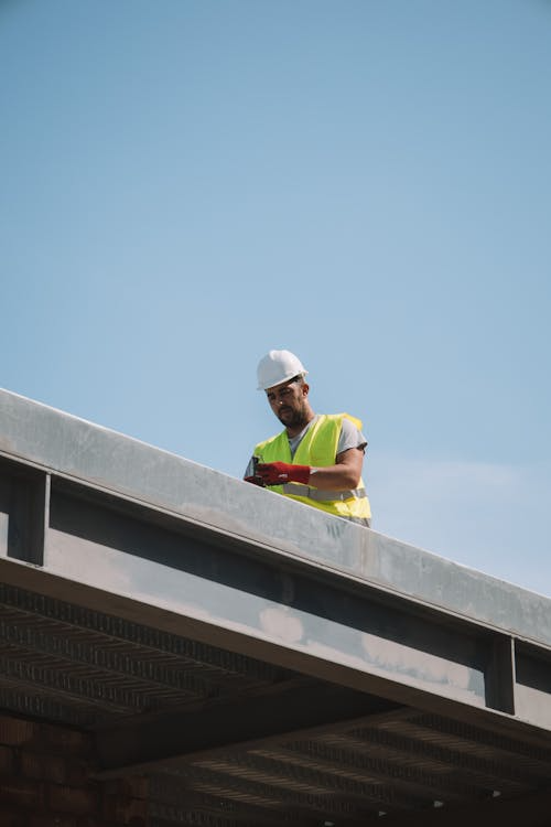A commercial roofing contractor on a roof
