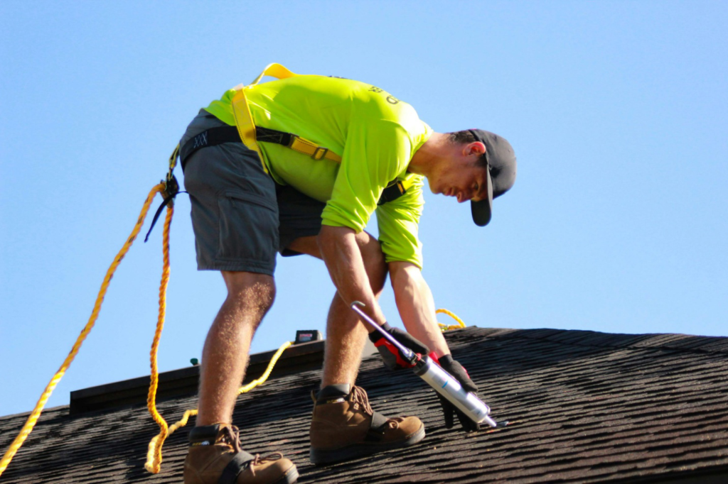 A roofer working on a roof