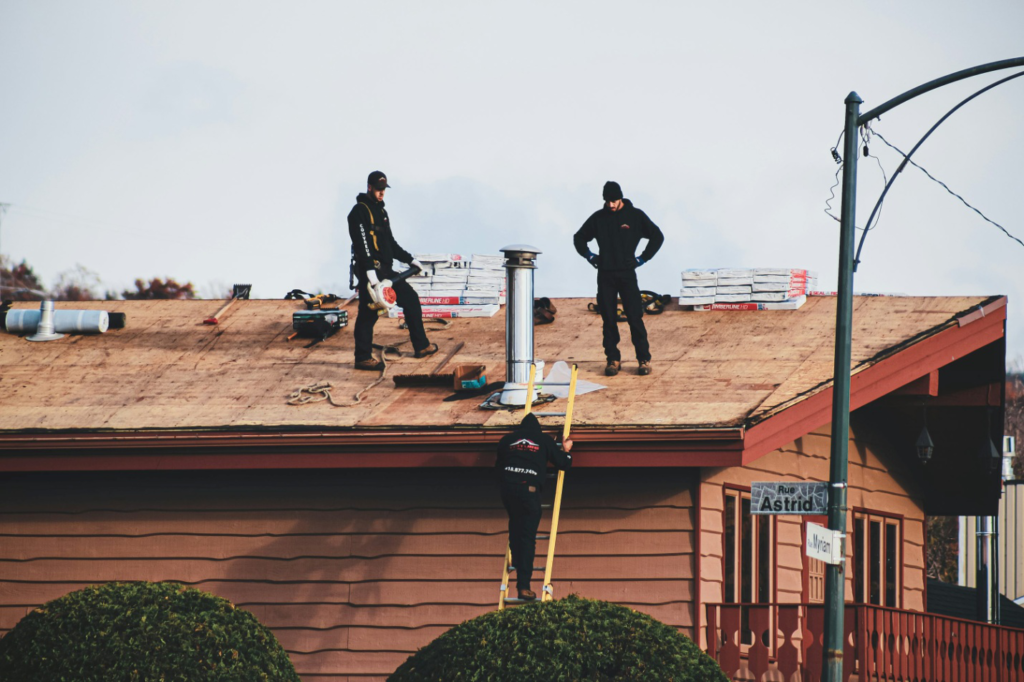Roofers carrying out roof maintenance