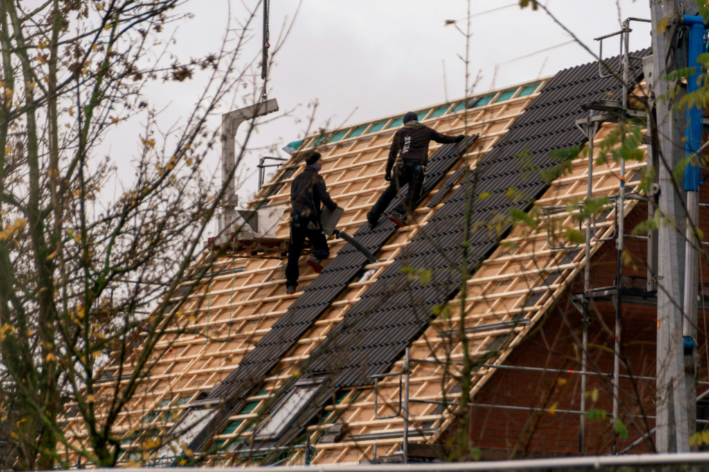 A roofer working on a roof