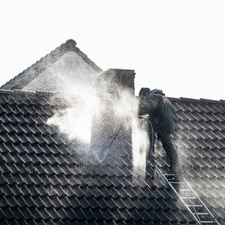 a roof surface being cleaned