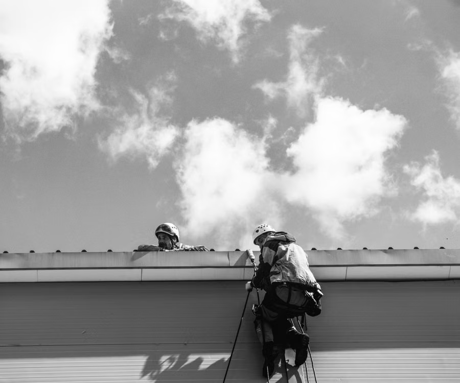 Workers inspecting rooftop