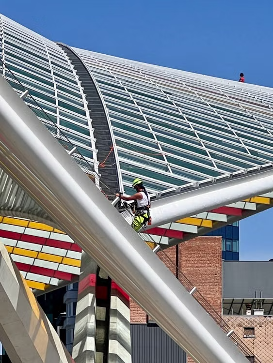 Worker evaluating roof structure