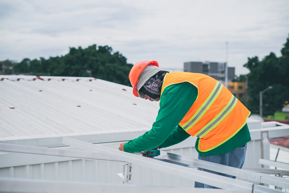 Worker maintaining rooftop